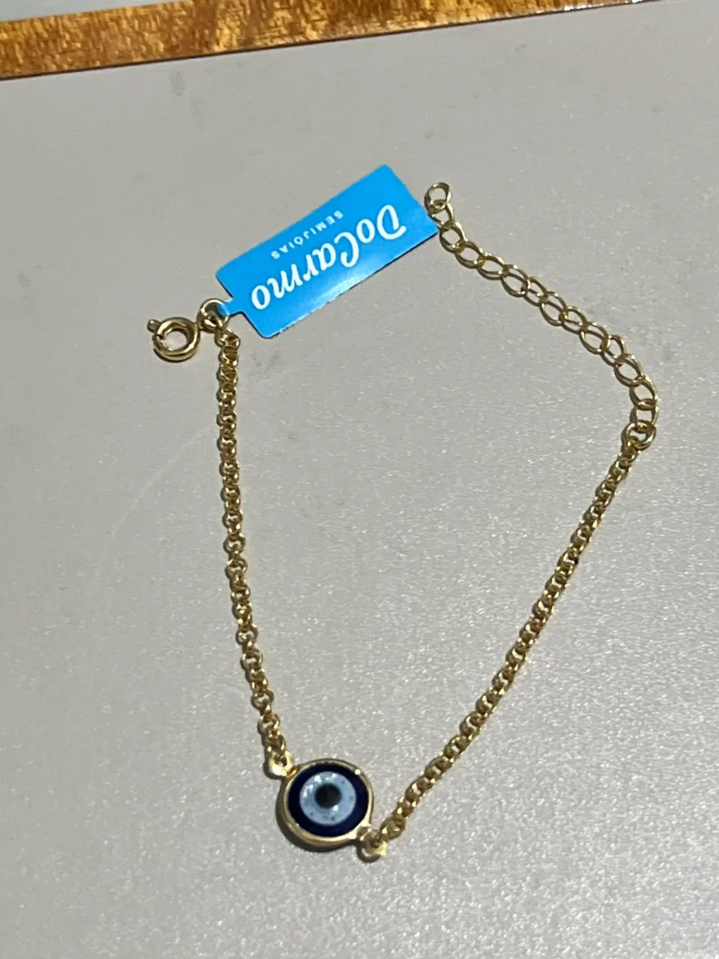 pulseira com pingente olho grego