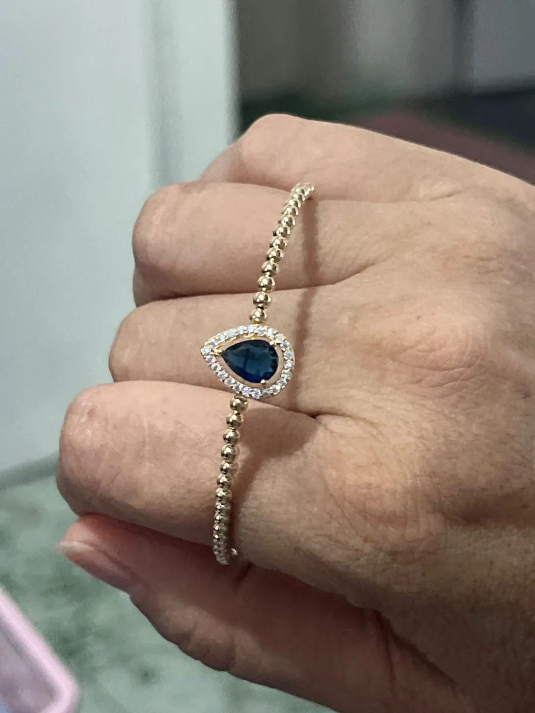 Bracelete gota azul crav.
